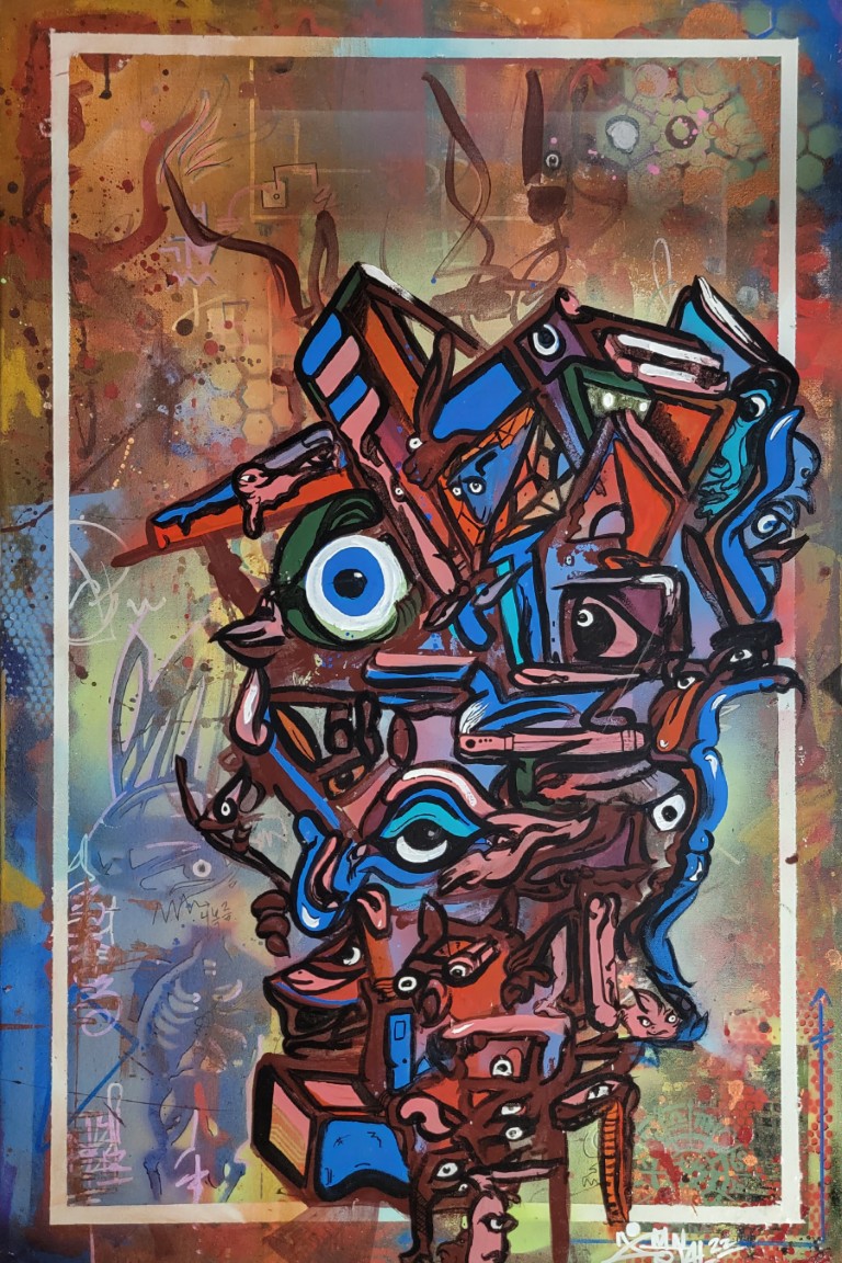 Colorful vertical totem of stacked eyes, faces, and animal forms in blue, sienna, and gold by Michael MacDonald
